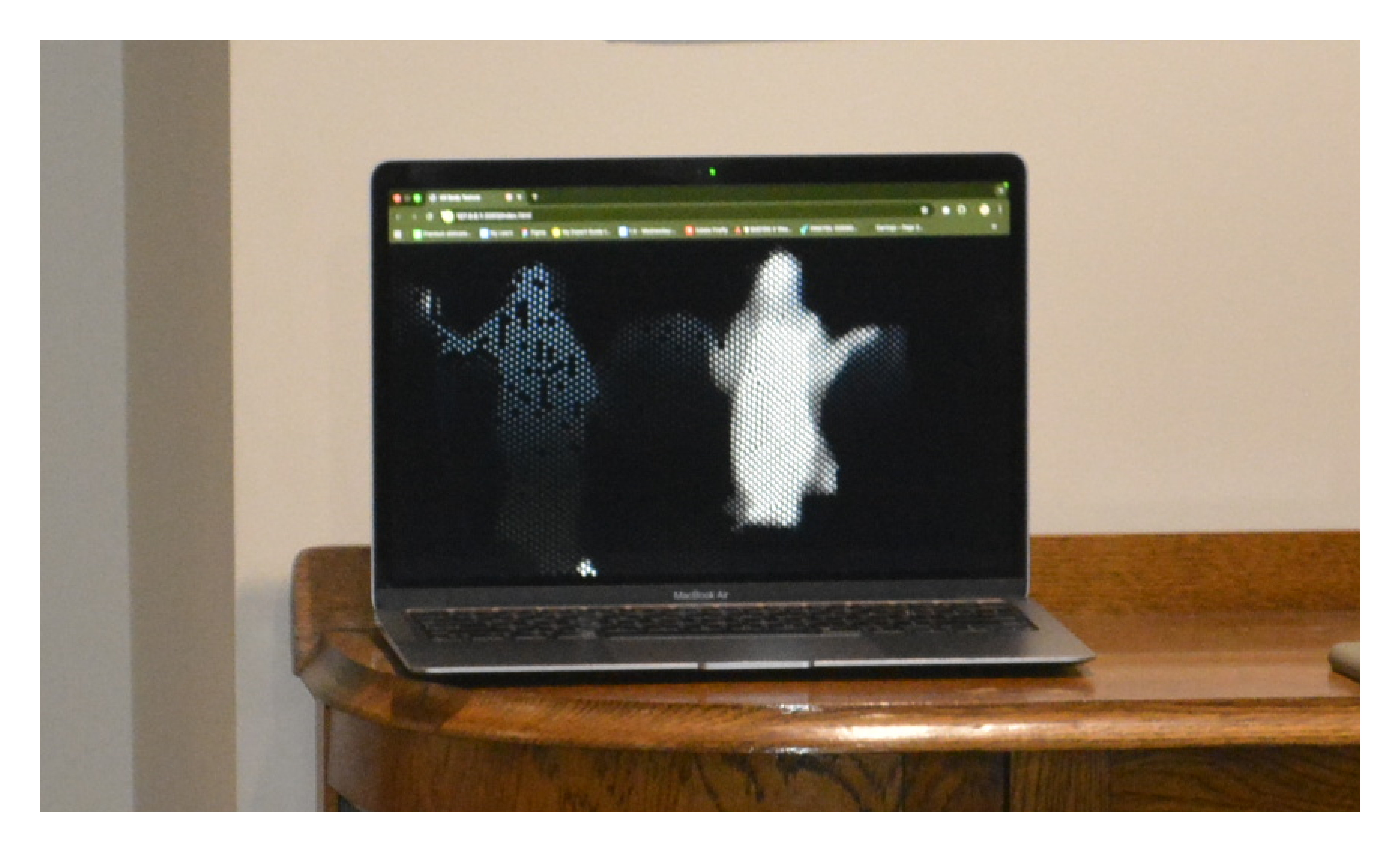 MacBook showing ghost figure