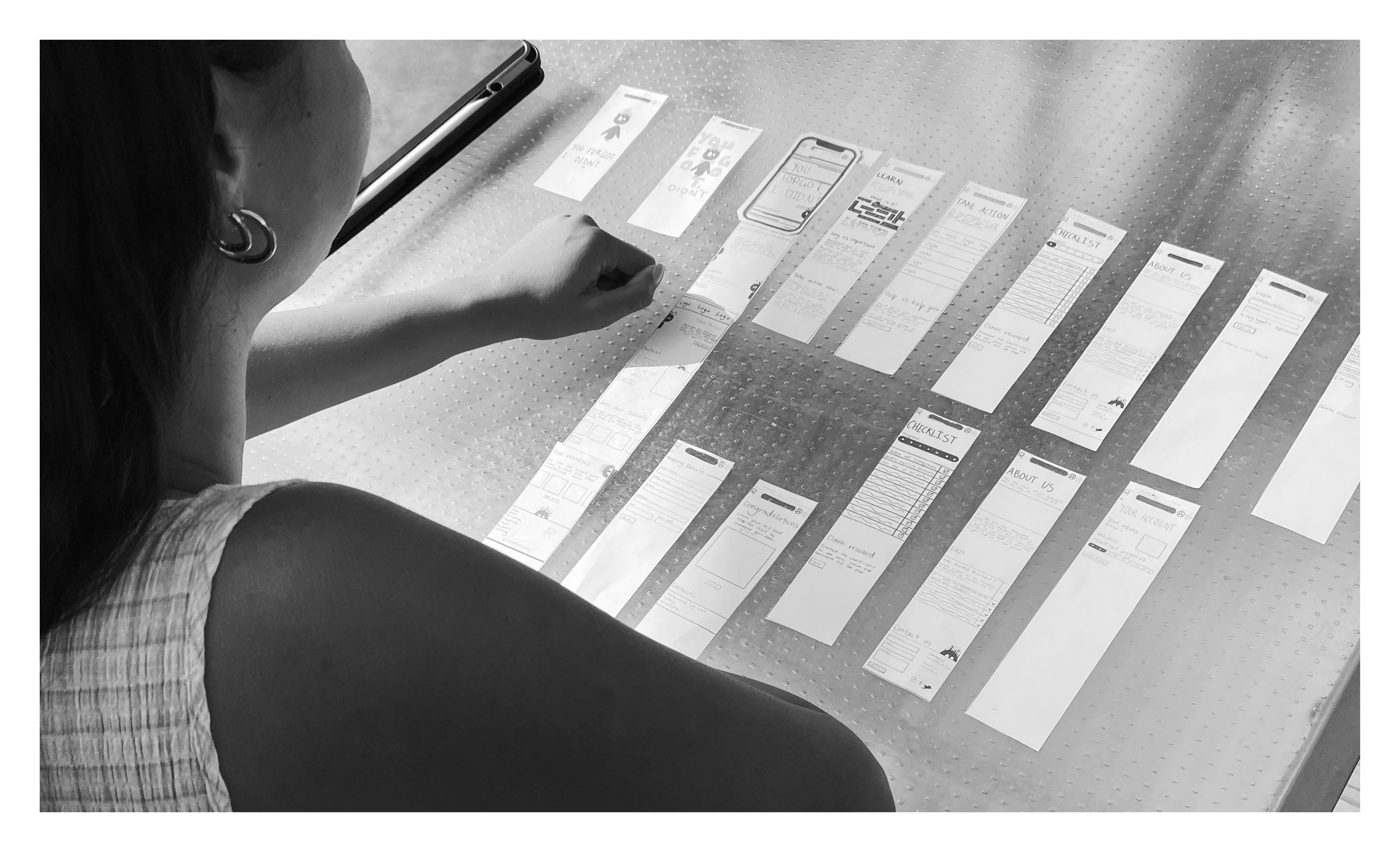 Paper prototypes laid out on table