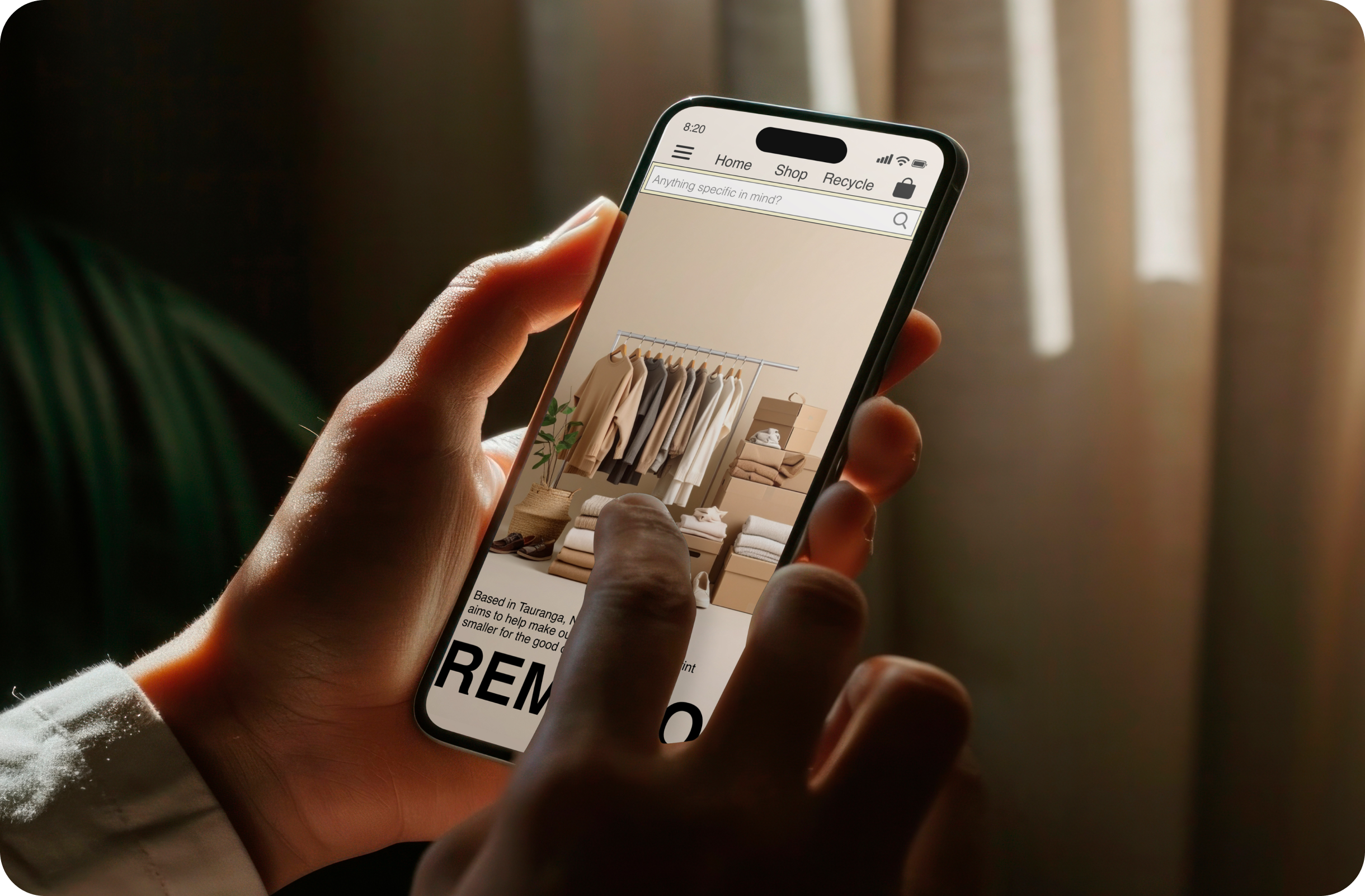 Hand holding phone showing Remaro app